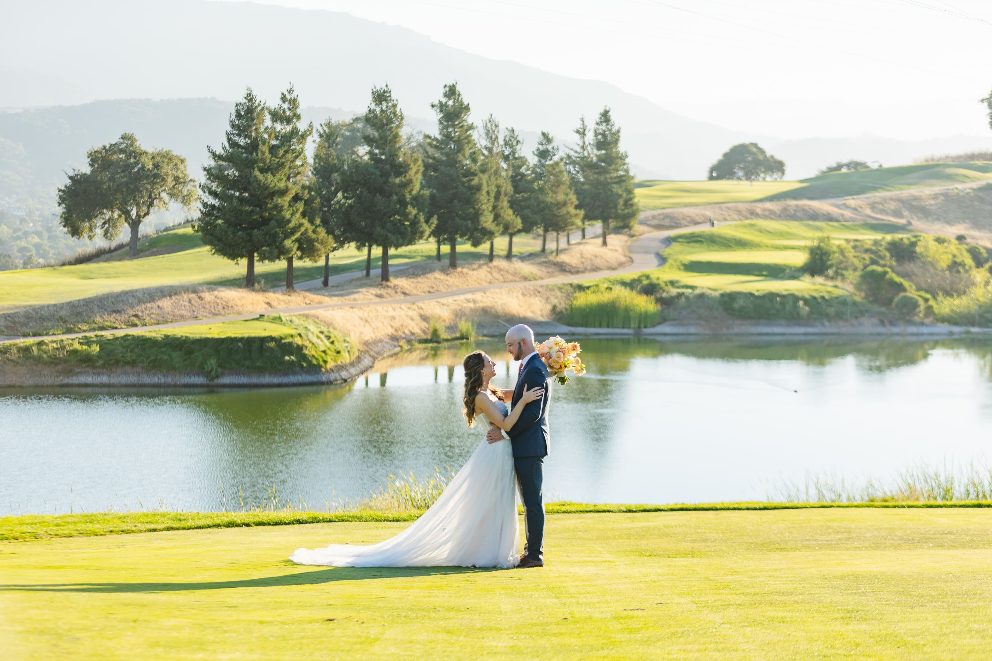 Boulder Ridge by Wedgewood Weddings Water Backdrop Couple